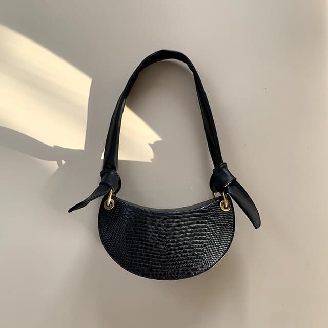 Bolsa feminina de ombro única, estilo meia-lua, que combina com tudo.