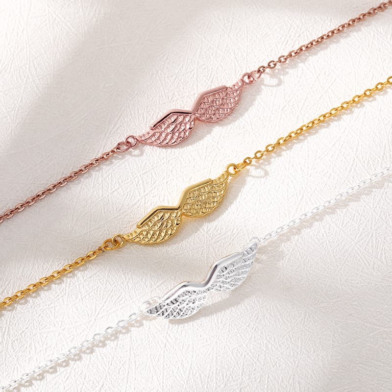 Pulseira feminina com pingente de asa de anjo dourada 5