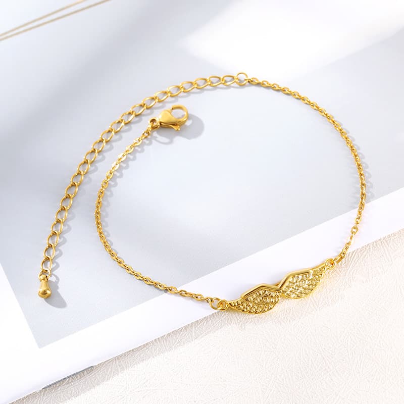Pulseira feminina com pingente de asa de anjo dourada 3